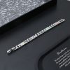 The Monogram Tied Up bracelet is forged from polished metal into a connecting plaque with LV lettering and Monogram flowers engraved on both sides